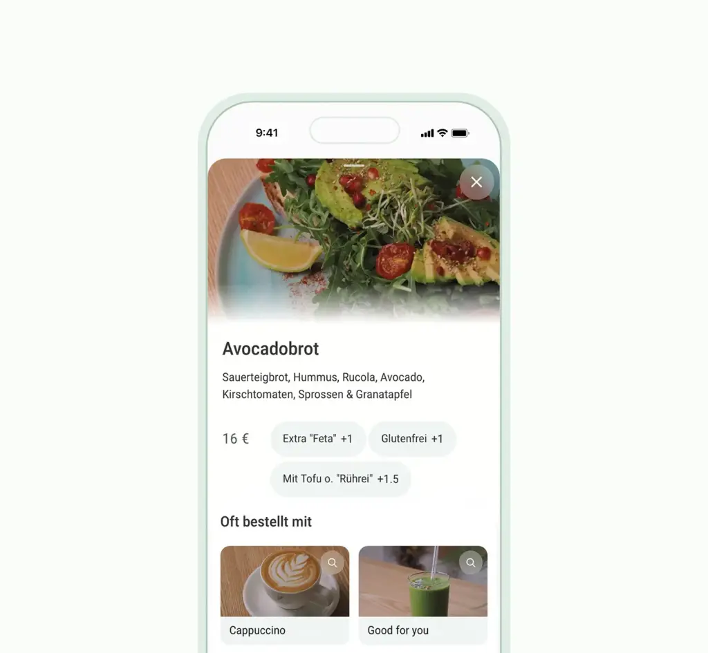 Interaktive Artikelansicht – Avocadobrot mit wählbaren Extras wie Feta oder Glutenfrei und passenden Empfehlungen wie Cappuccino
